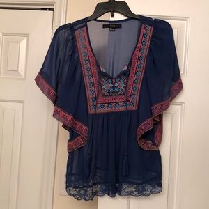 Beautiful sheer blue blouse.